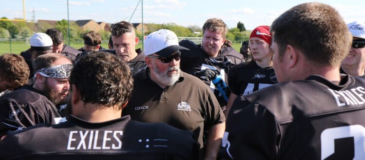 Head Coach John Moore rallies his troops post win